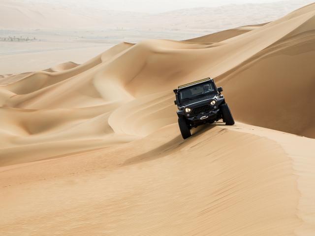 Surf the dunes on 4WD at sunset