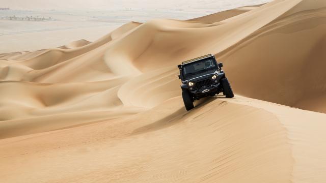 Surf the dunes on 4WD at sunset