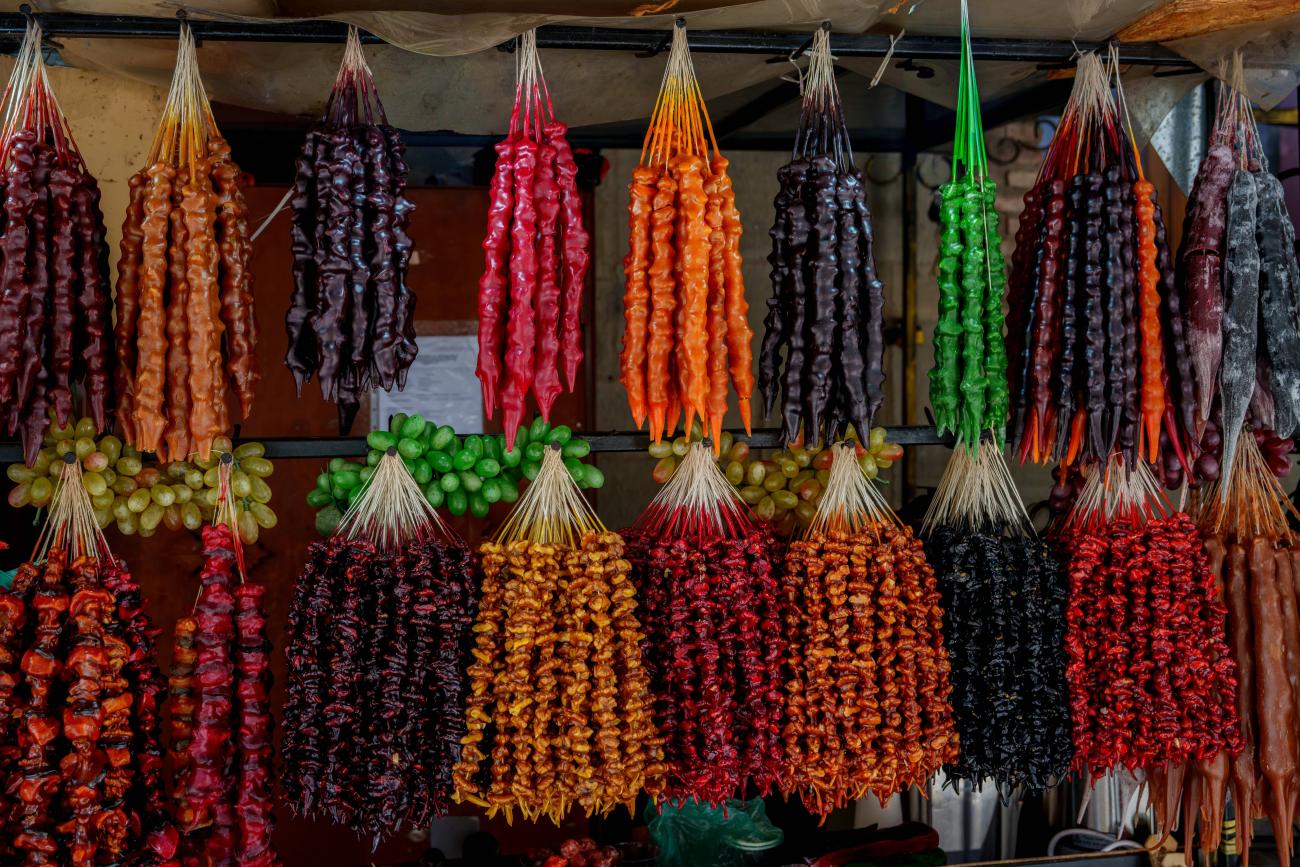 Georgian sweet treat called Churchkhela, hanging on a market stall