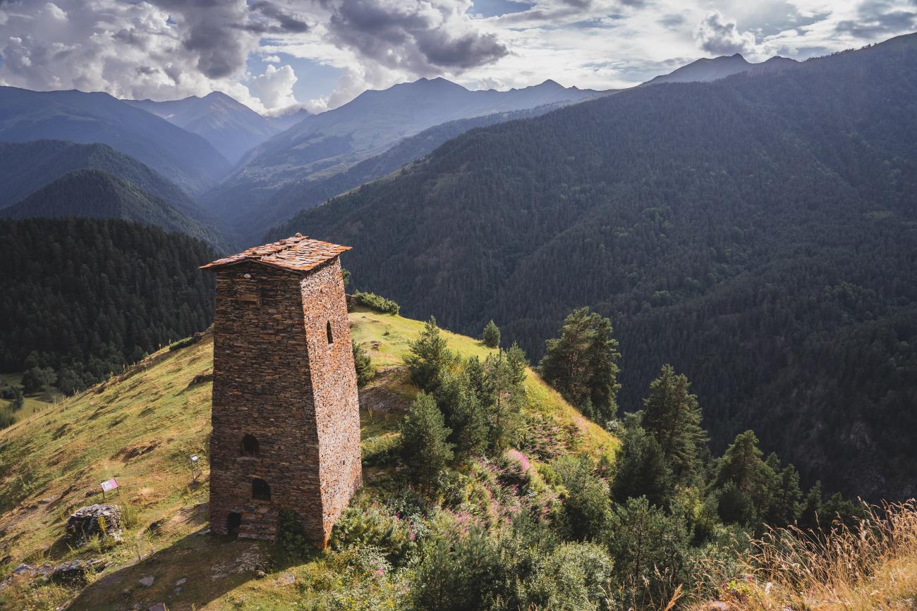 Tushetian watchtower overlooking the forested mountains and valleys in Georgia