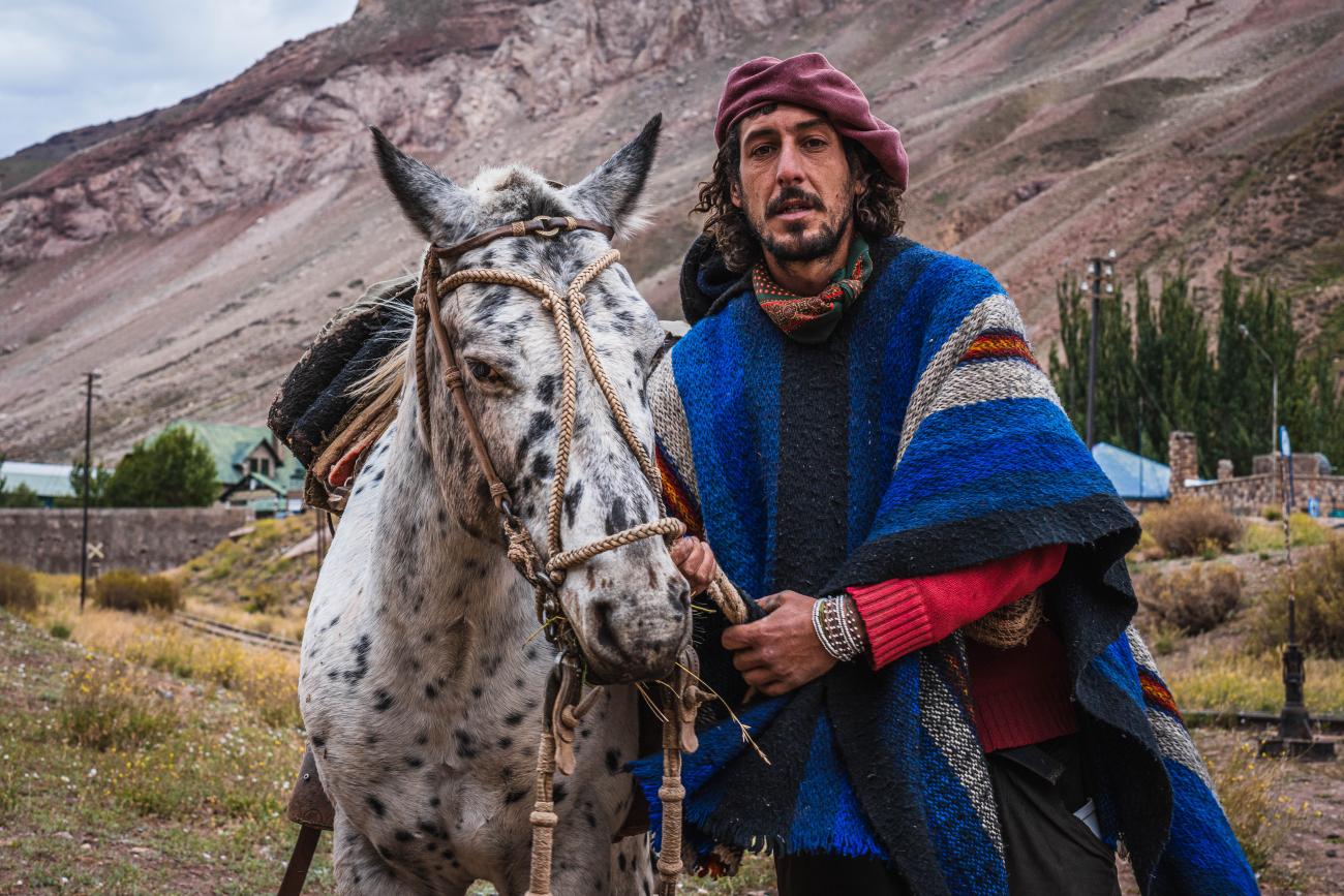 Argentinian gaucho (cowboy) with his horse 